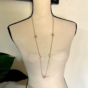 Elegant Gold Necklace with light pink Accents stones and rhinestones.